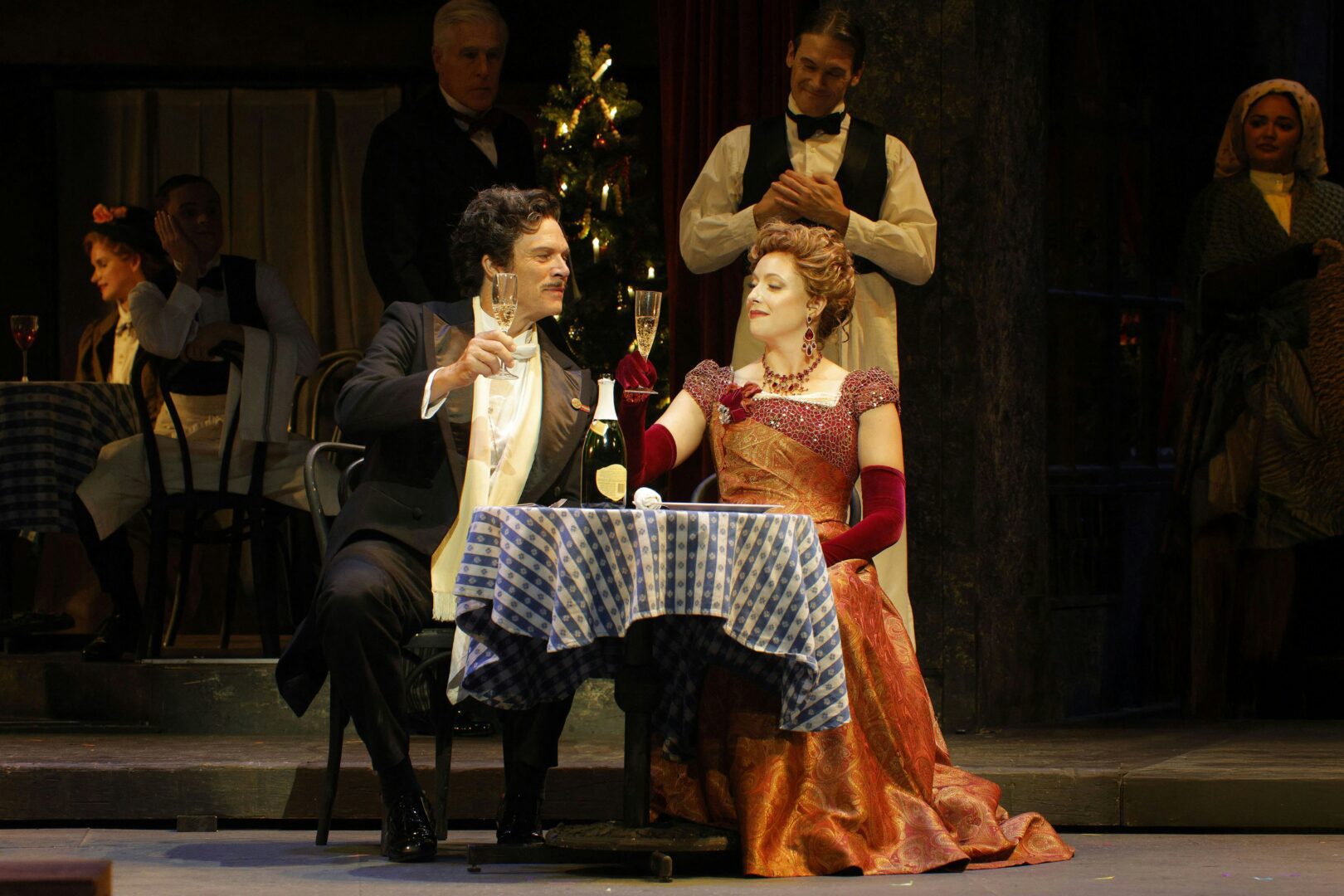 Rod Gilfry as Alcindoro and Erica Petrocelli as Musetta in LA Opera's 2025 production of    La Bohème. (Photo by Cory Weaver)